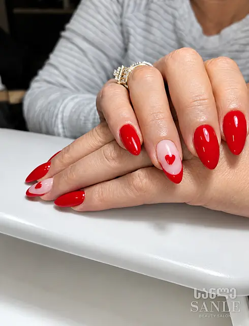 Red manicure with a heart — work by SANLE