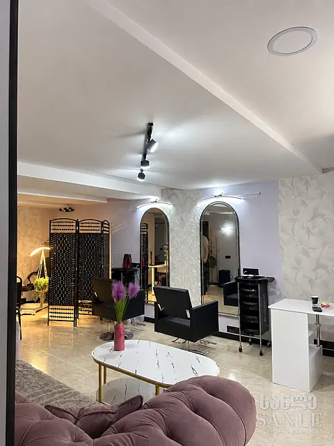The SANLE salon floor with hair styling chairs, on Marjanishvili